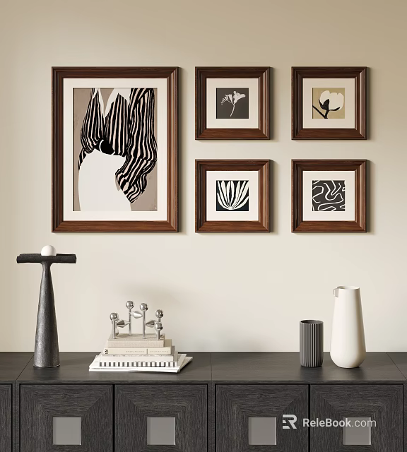 Framed Abstract Paintings on Wall with Decorative Vase Candle Holder and Book Stack 3d model