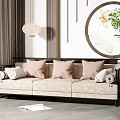 Beige Patterned Three Seater Sofa with Pink White Pillows Round Wall Art and Green Plant