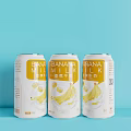 Three Cans of Banana Milk Drink with Light Blue Background and Banana Graphics
