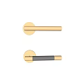 Modern Golden Door Handle With Sleek Design On Light Colored Door Surface