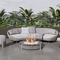 L Shaped Wicker Outdoor Sofa With Fire Pit Table And Green Plants 3d model