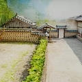 Traditional Korean Courtyard Landscape With Tile Roof Houses Stone Walls And Green Plants