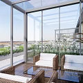 Modern Outdoor Glass Corridor With Landscaped Plants And Paved Walkway