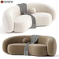 Curved Beige And Brown Sofa With Gray Throw Blanket And Round Pillow