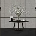 Modern Console Table With Round Tabletop White Blossom Vase And Wall Sconces Against Textured Wall