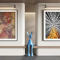 Two Abstract Paintings Hanging On Wall With Blue Rabbit Sculpture In Modern Interior