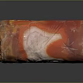 Natural Cylindrical Stone With Vibrant Red Orange Yellow White Patterns And Central Hole