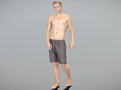 Shirtless Man Standing Barefoot in Gray Shorts Against Gray Background 3d model