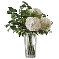 White Roses and Hydrangeas in Glass Vases with Green Leaves and Branches