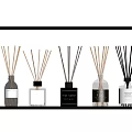 Assorted Scented Fragrance Diffuser Bottles with Reed Sticks Displayed on Shelf