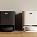 Pamko Black And White Robotic Vacuum Cleaners On Home Wooden Floor
