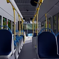 White Modern City Bus With Open Doors And Green Tree Surroundings