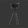 Vintage Electronic Camera With Blue Decorated Body On Metal Tripod Stand