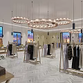 Elegant Clothing Store With Circular Chandeliers Herringbone Floor Large Windows And Clothes On Racks