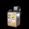 Vintage CRT Television Placed on a Cabinet with Colorful Stickers and Decorations