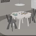 Three Petal Flower Shaped Kids Table With Rabbit Ear Chairs And Building Blocks On Minimalist Rug