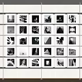 Black and White Photos Arranged on White Display Shelf Gallery Wall