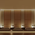 Serene Spa Treatment Room With Three Massage Beds Arched Lit Decor And Wooden Flooring