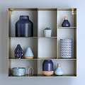 Stylish Ceramic Vessels With Blue Tones Various Shapes And Geometric Patterns On Display Shelf