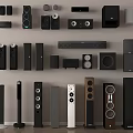 Diverse Collection of Headphones and Speakers Arranged on Wall and Floor