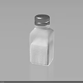 Clear Glass Salt Shaker With Perforated Lid Filled With White Table Salt For Kitchen Use