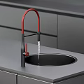 Modern Red Faucet With Black Base Water Dripping Over Kitchen Sink Countertop
