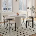 Modern Round Marble Table With White Chairs Black Armrests And Snowy Window View