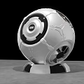 Modern Tech Inspired Spherical Silver White Sculpture With Black Circular Accents And Metallic Base