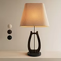 Wooden Base Table Lamp With Linen Shade And Three Spherical Decorations On Light Desk