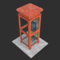 Vintage Red Phone Booth With Glass Doors On Concrete Pedestal Base