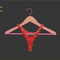 Elegant Red Lace Camisole Hanging On Wooden Hanger Against Dark Backdrop