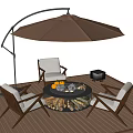 Outdoor Chairs With White Cushions Around Fire Pit Table On Wooden Deck And Brown Umbrella