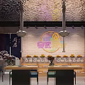 Cozy Restaurant Interior With Neon Sign Brick Wall Fruit Display And Metallic Ceiling