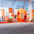 Orange Themed Exhibition Display With Photo Boards Text Content And Flower Decorations