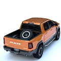 Orange Dodge RAM Pickup Truck With Black Hood Side Steps And Large Off-Road Tires