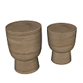 Two Natural Wood Side Tables With Smooth Round Tops And Elegant Curved Bases