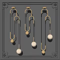 Pendant Lights with Golden Metal Frames Black Lines and Round Bulbs Against Dark Wall
