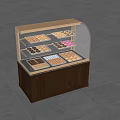 Glass Gold Frame Dessert Display Shelf With Various Pastries Chocolates And Biscuits