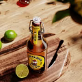 Cider Bottle And Glass With Fresh Limes And Knife On Wooden Table With Green Plants