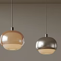 Two Modern Pendant Lights Brown And Silver Spherical Design Hanging Against Gray Background