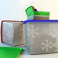 Tupperware Stackable Storage Containers With Green Red Silver Blue Lids And Snowflake Patterns