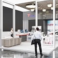 Modern Exhibition Booth With SUNRISE Logo Workstations People And Display Area