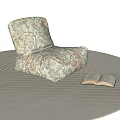 Cozy Floral Pattern Bean Bag Chair with Open Book on Soft Indoor Carpet