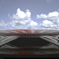 Scenic Modern Landscape Bridge With Orange White Striped Design Spanning Water And Reflection