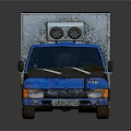 Blue Truck With White Cargo Container Featuring Colorful Cartoon Graffiti Design