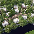 Scenic Waterfront Residential Community With White Houses Surrounded By Lush Green Trees