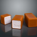 Three Square Caramel Colored Candies With White Filling On Dark Surface 3d model