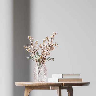 Clear Glass Vase with Small Yellow Blossoms and Green Leaves on Wooden Table with Books 3d model