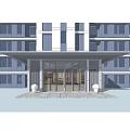 Modern Entrance Gate Of Contemporary Building With Glass Panels Greenery And Stone Pathway