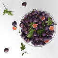 Fresh Purple Figs in Glass Bowl with Golden Stand and Sliced Fruits with Green Leaves
